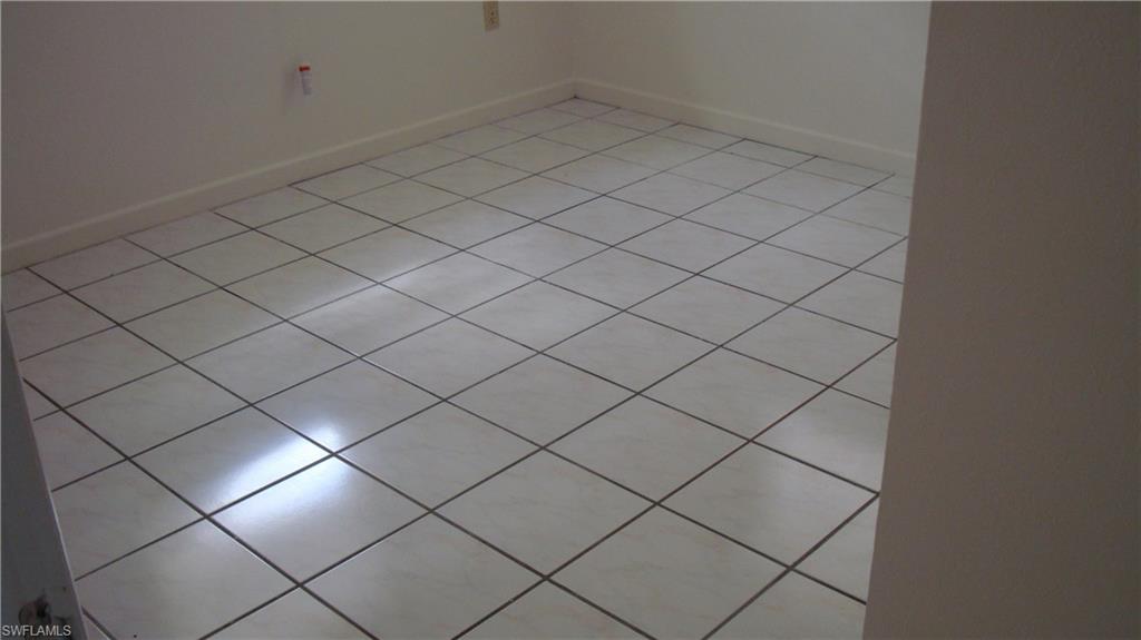 302 East Jersey Road Lehigh Acres, FL 33936 - Photo 7 of 10 a view of a garage