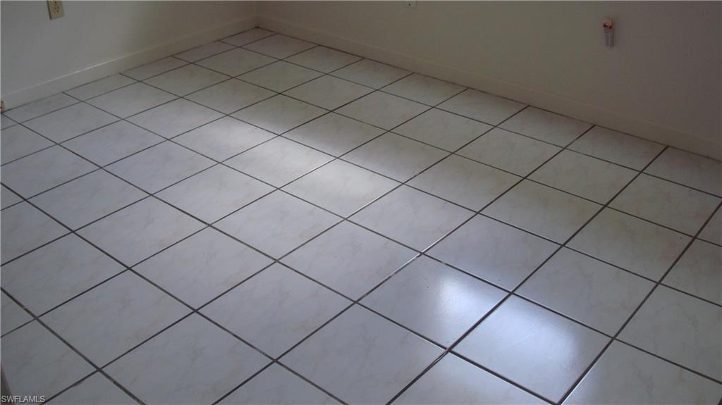 302 East Jersey Road Lehigh Acres, FL 33936 - Photo 8 of 10 a view of a garage