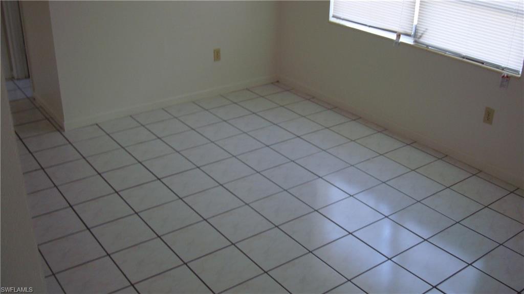 302 East Jersey Road Lehigh Acres, FL 33936 - Photo 9 of 10 a view of a garage and window