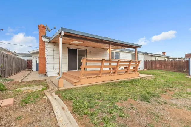 a view of house with backyard porch and entertaining space