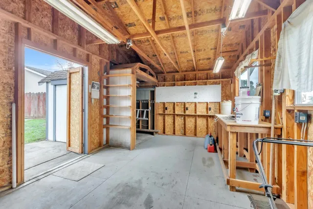 a view of an empty room with wooden walls