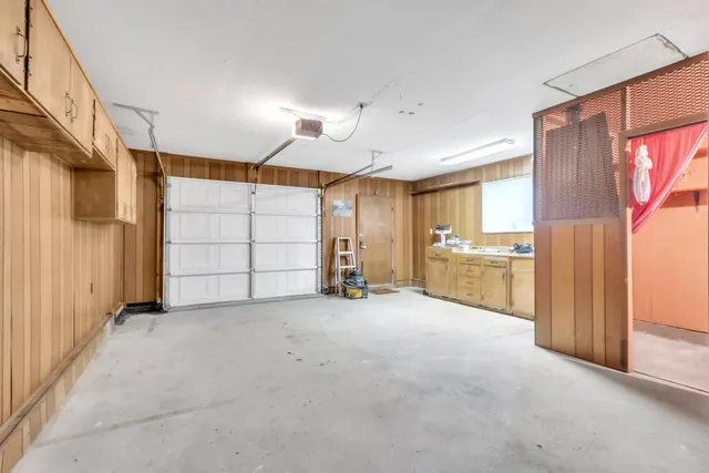 a view of a kitchen with a sink and cabinet