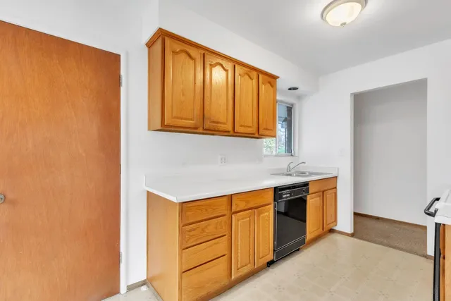 a kitchen with stainless steel appliances granite countertop a sink and a cabinets