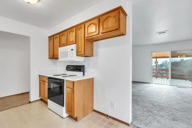 a view of a kitchen with furniture and a kitchen