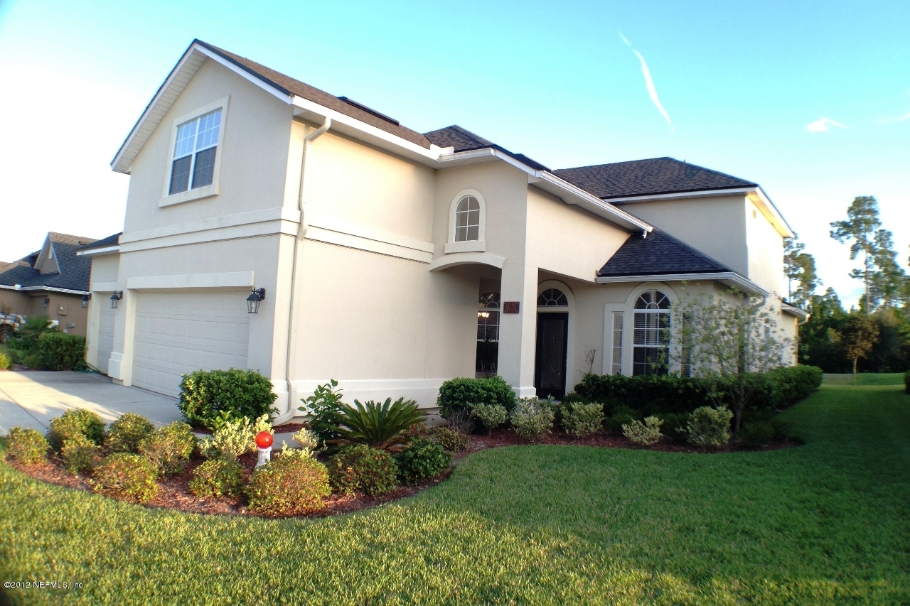 6092 White Tip Road Jacksonville, FL 32258 - Photo 1 of 32 a front view of a house with a garden