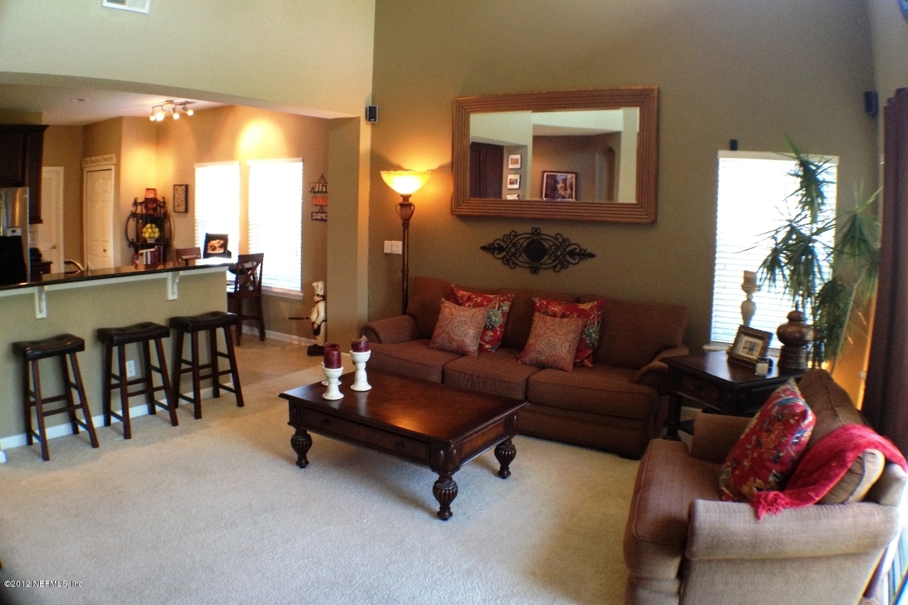 6092 White Tip Road Jacksonville, FL 32258 - Photo 12 of 32 a living room with furniture and a large window