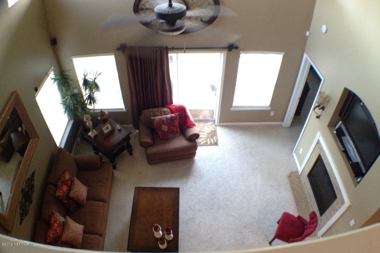 6092 White Tip Road Jacksonville, FL 32258 - Photo 21 of 32 a living room with furniture and a flat screen tv