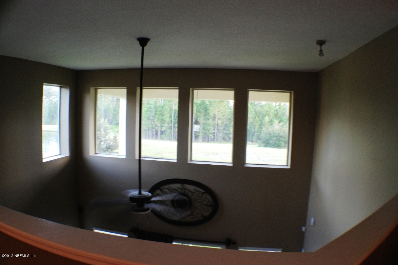 6092 White Tip Road Jacksonville, FL 32258 - Photo 22 of 32 a room with window and ceiling fan