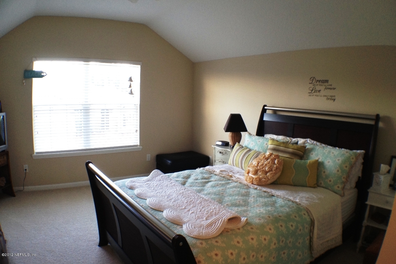 6092 White Tip Road Jacksonville, FL 32258 - Photo 24 of 32 a bedroom with a bed and window