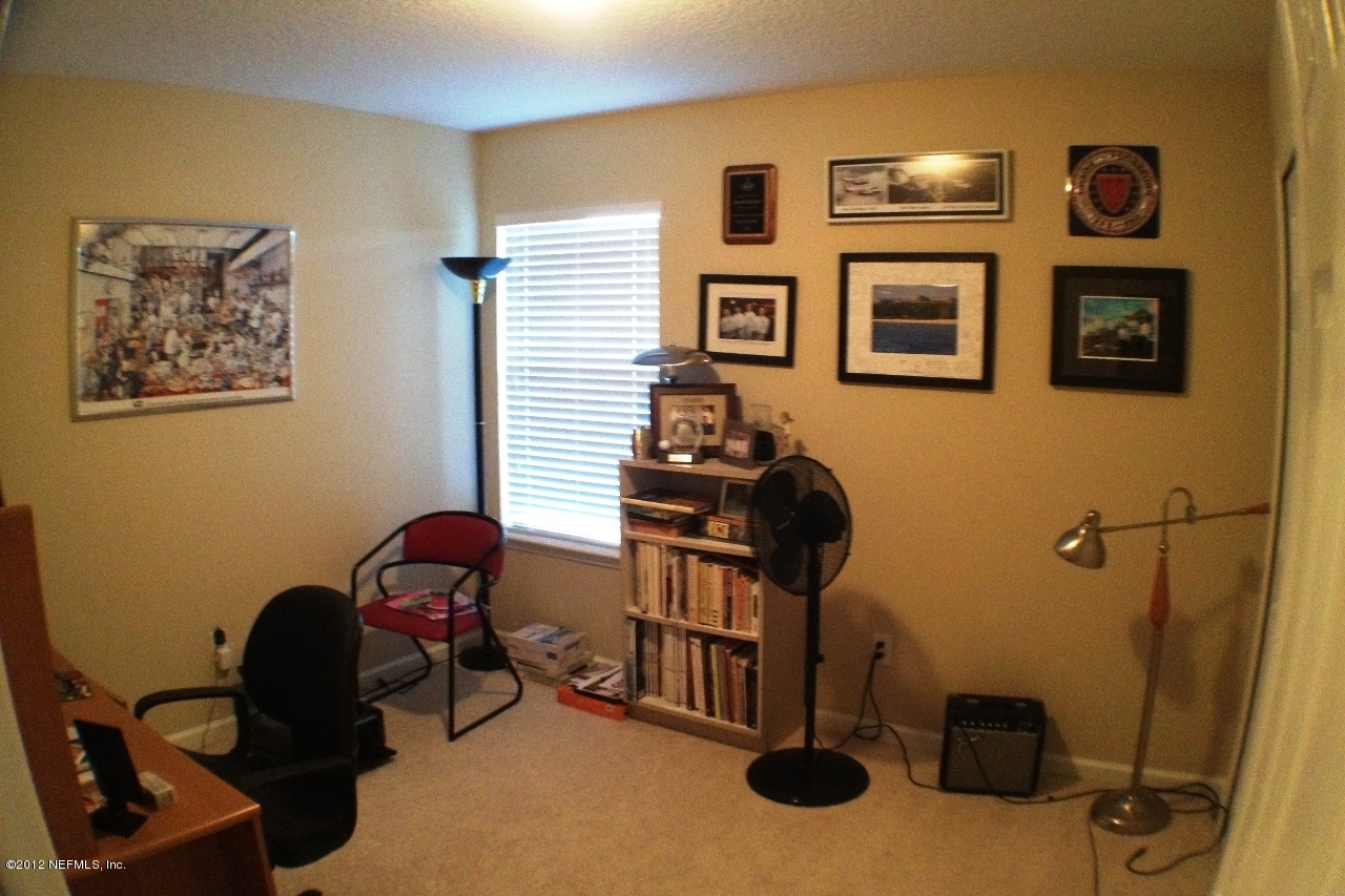 6092 White Tip Road Jacksonville, FL 32258 - Photo 25 of 32 a room with furniture and musical instruments