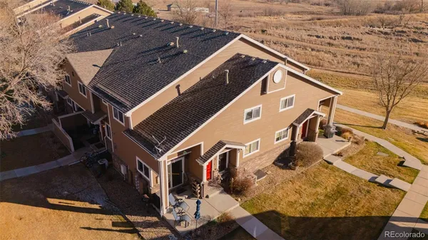 a aerial view of a house with a yard