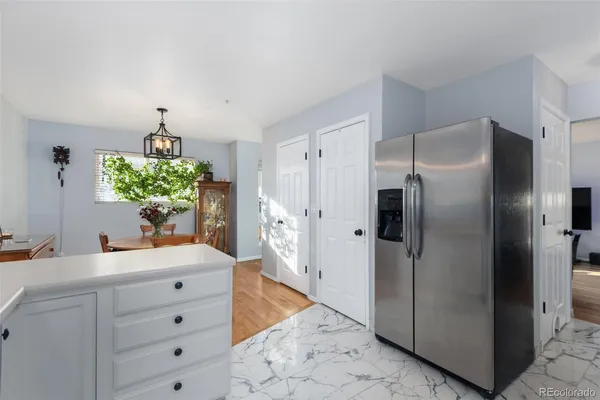a kitchen with refrigerator and counter