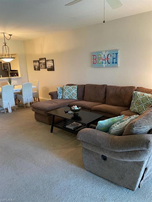 8085 Celeste Drive, Unit 812 Naples, FL 34113 - Photo 3 of 9 a living room with furniture and a couch