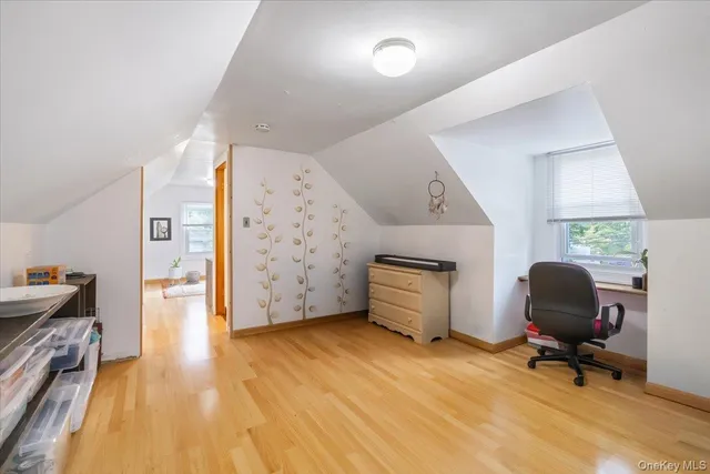 a workspace with furniture and wooden floor