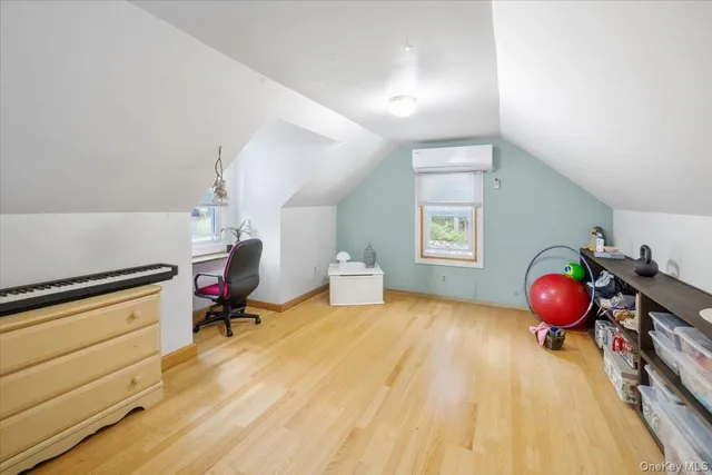 a room with a bed and cabinets