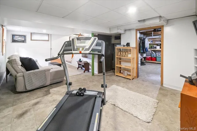 a view of a livingroom with furniture and a flat screen tv