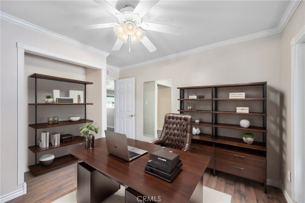 3976 Russ Court Simi Valley, CA 93063 - Photo 18 of 47 a living room with furniture a wooden floor and a bookshelf