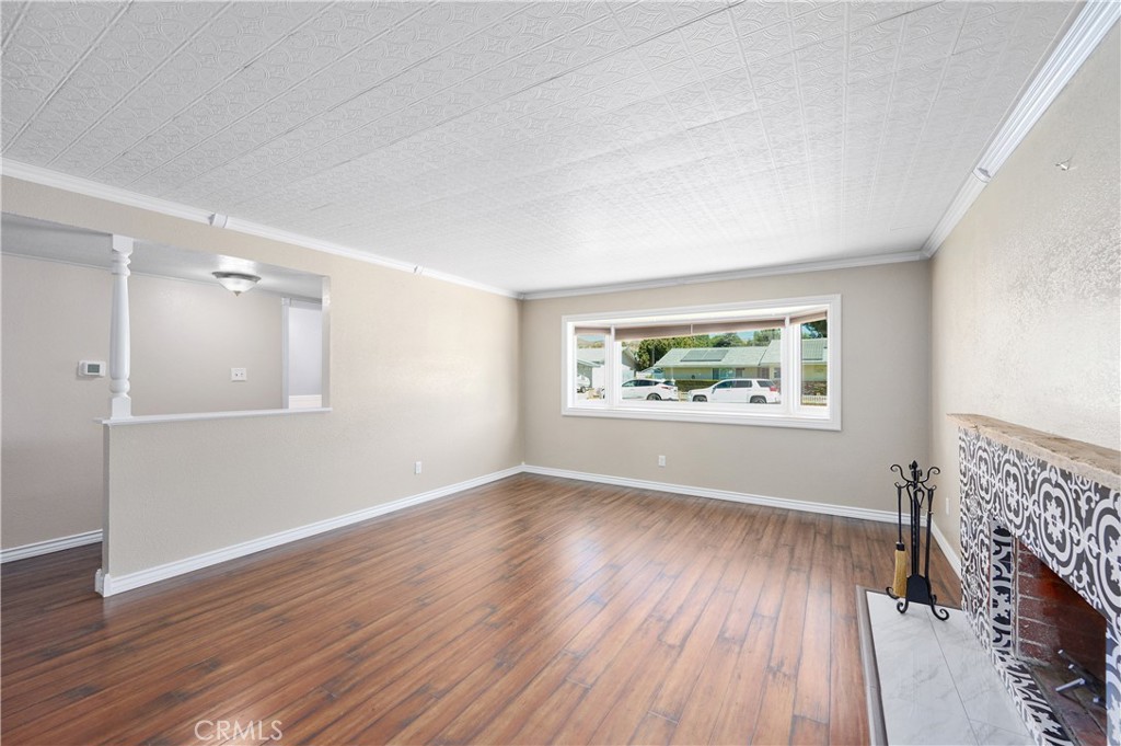 3976 Russ Court Simi Valley, CA 93063 - Photo 2 of 47 an empty room with wooden floor and windows