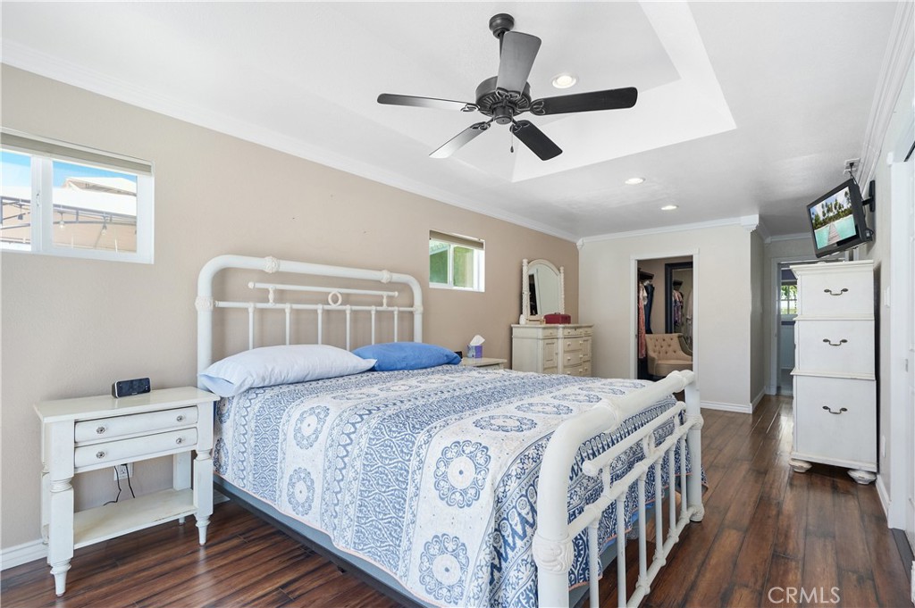 3976 Russ Court Simi Valley, CA 93063 - Photo 24 of 47 a bedroom with a bed and a chandelier