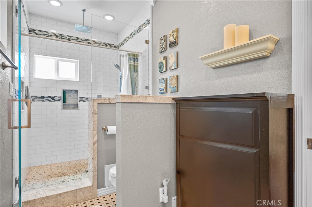 3976 Russ Court Simi Valley, CA 93063 - Photo 30 of 47 a bathroom with a shower and a sink