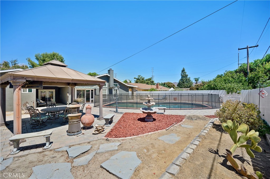 3976 Russ Court Simi Valley, CA 93063 - Photo 36 of 47 a view of a patio with chairs and potted plants