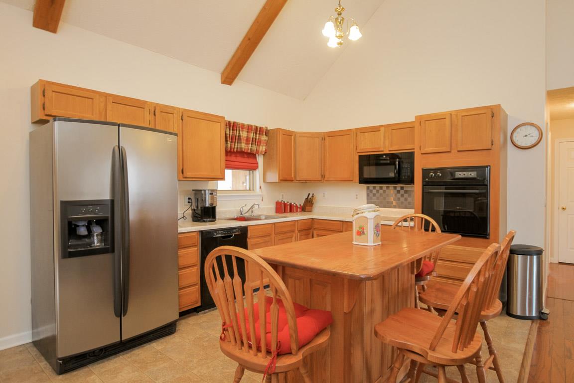 214 South Palmers Chapel Road Cottontown, TN 37048 - Photo 11 of 27 Highly functional and warm kitchen area inspires culinary adventure ranging from intimate to large group entertaining