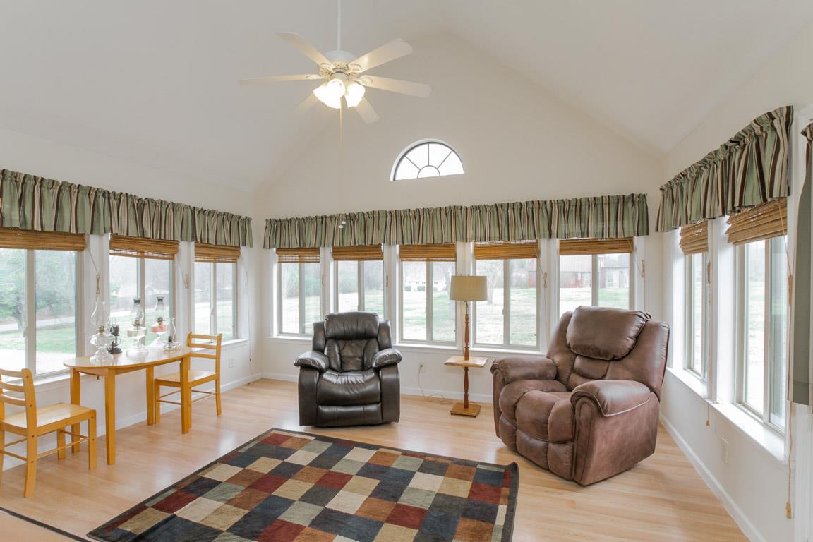 214 South Palmers Chapel Road Cottontown, TN 37048 - Photo 22 of 27 Wall to wall windows in a sun drenched and roomy space on the main floor that is your window to the world of rolling hills that surround your new home