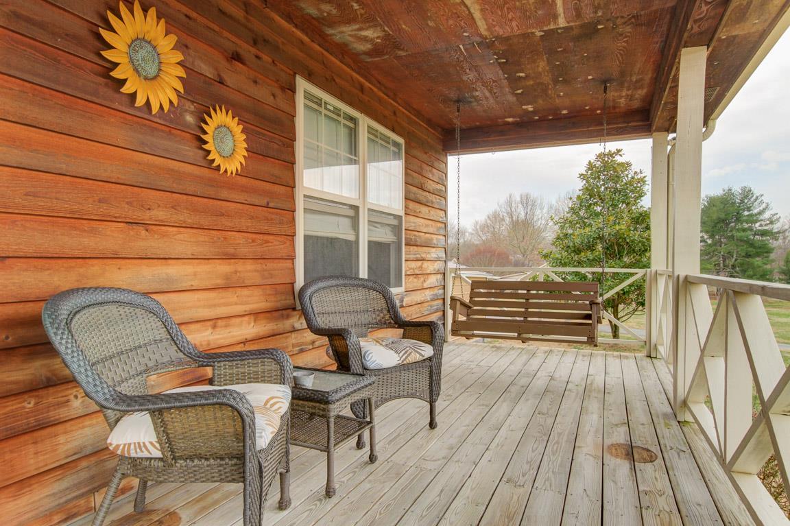 214 South Palmers Chapel Road Cottontown, TN 37048 - Photo 6 of 27 Wide covered deck runs the length of the front of the house! Enjoy nature and the peace and quiet that awaits you!