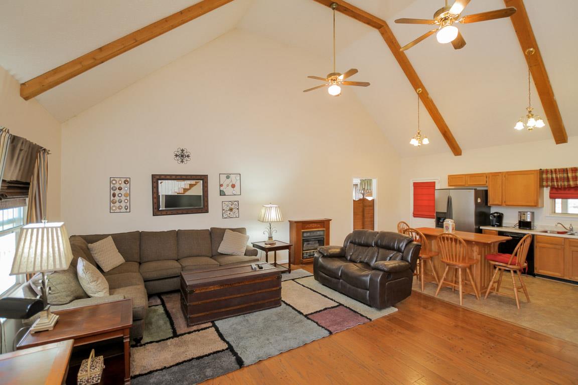 214 South Palmers Chapel Road Cottontown, TN 37048 - Photo 7 of 27 Soaring cathedral ceilings with exposed rough cut wooden beams create a dramatic statement