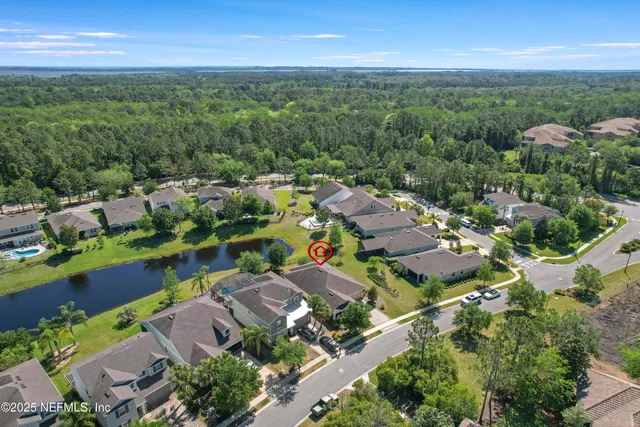 an aerial view of a house with outdoor space