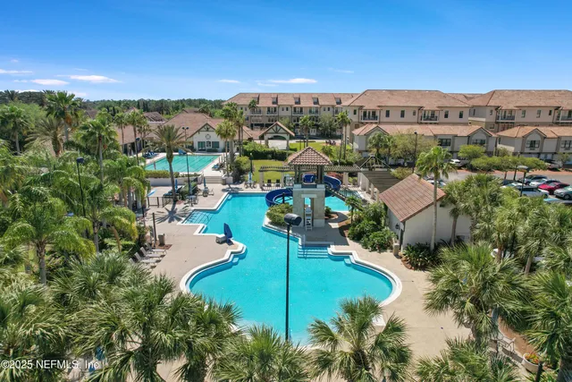 an aerial view of a residential houses and city view