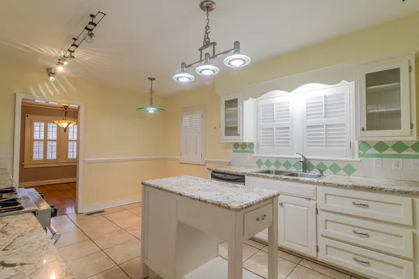 a kitchen with a sink and stove