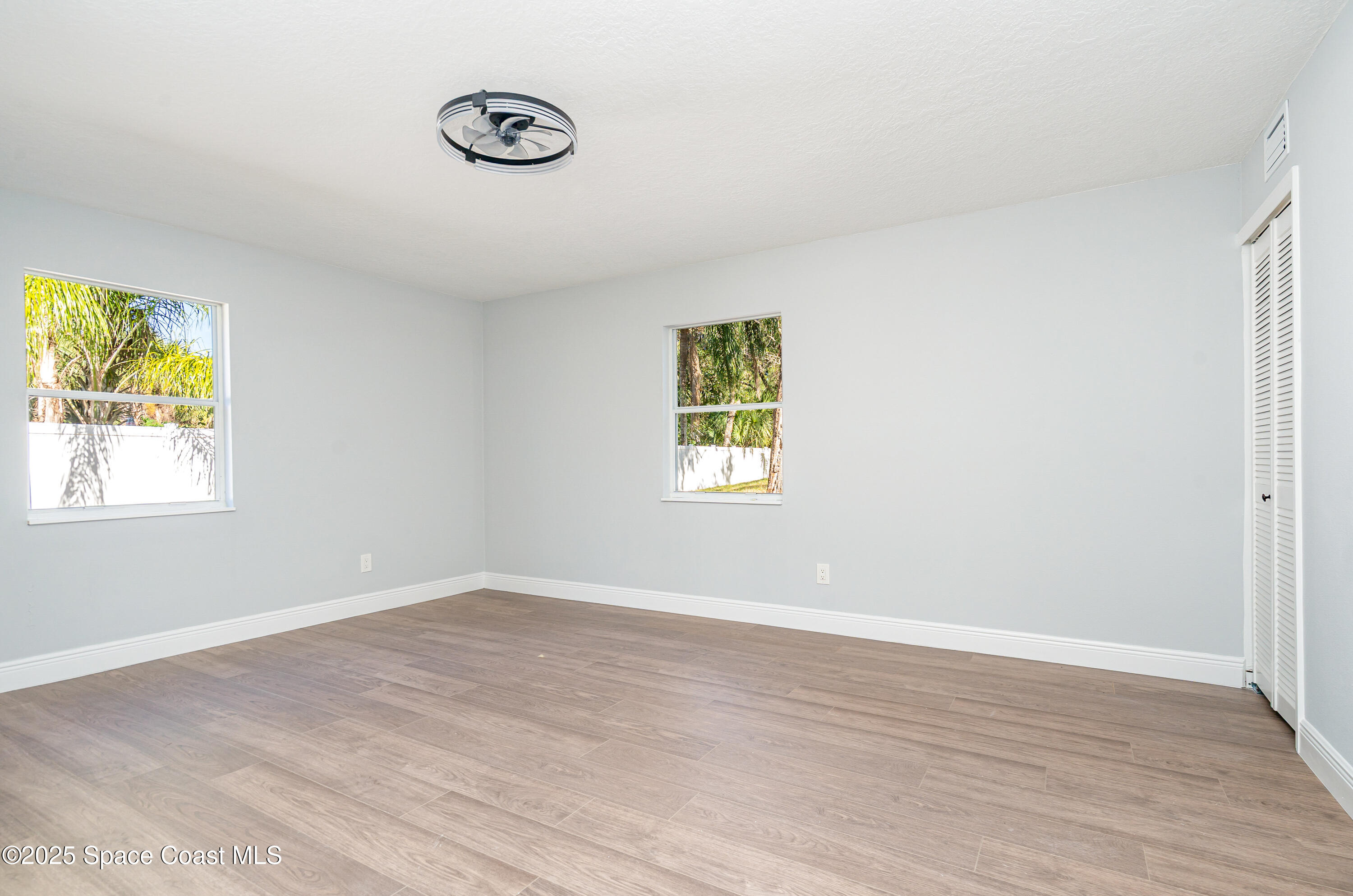 1735 Marywood Road Melbourne, FL 32934 - Photo 16 of 25 a view of a room with wooden floor and window