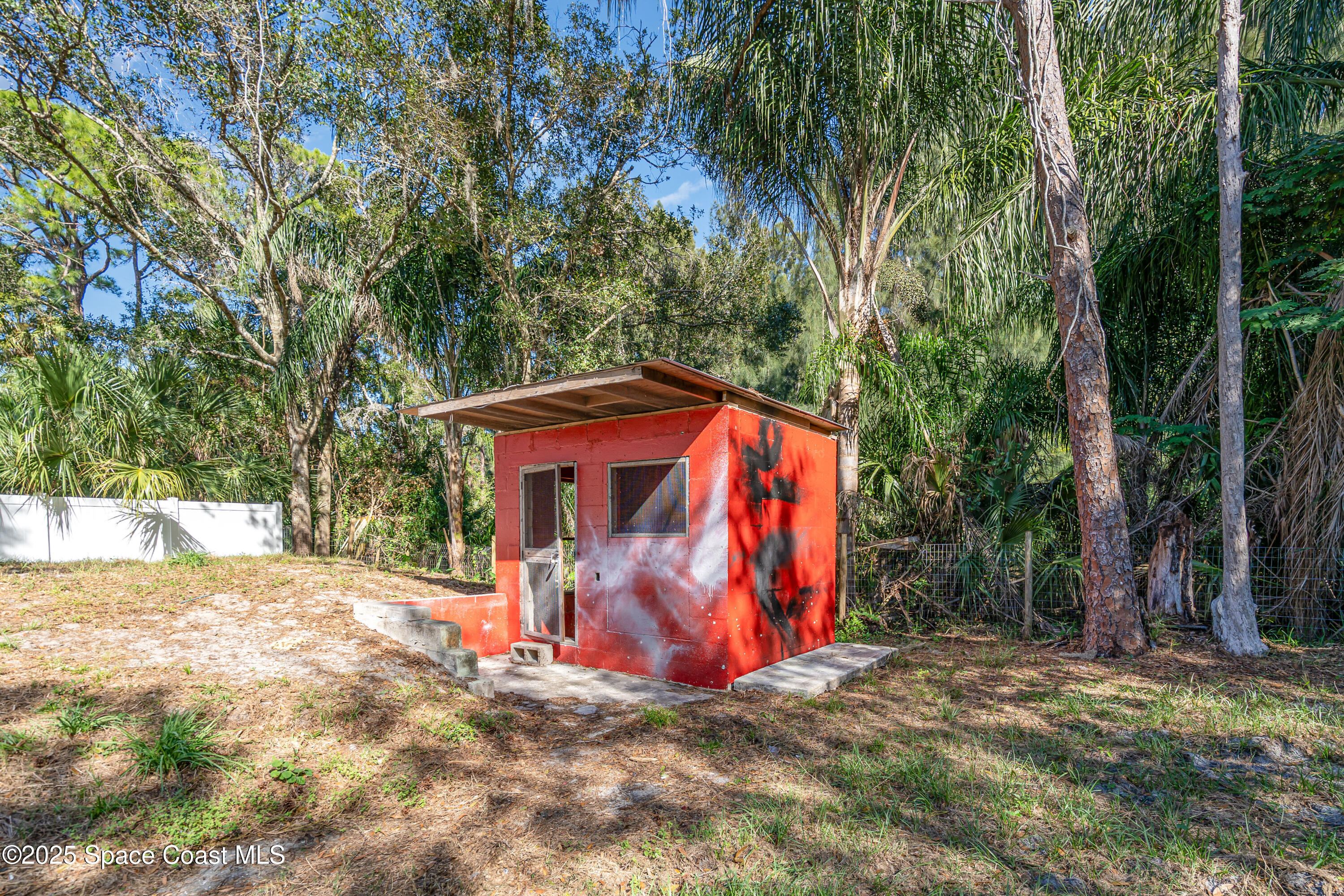 1735 Marywood Road Melbourne, FL 32934 - Photo 25 of 25 a view of a yard with a tree