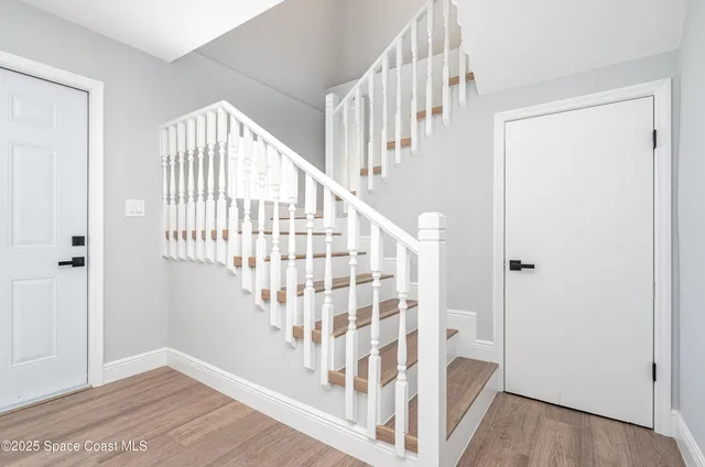 a view of staircase with white walls and white walls