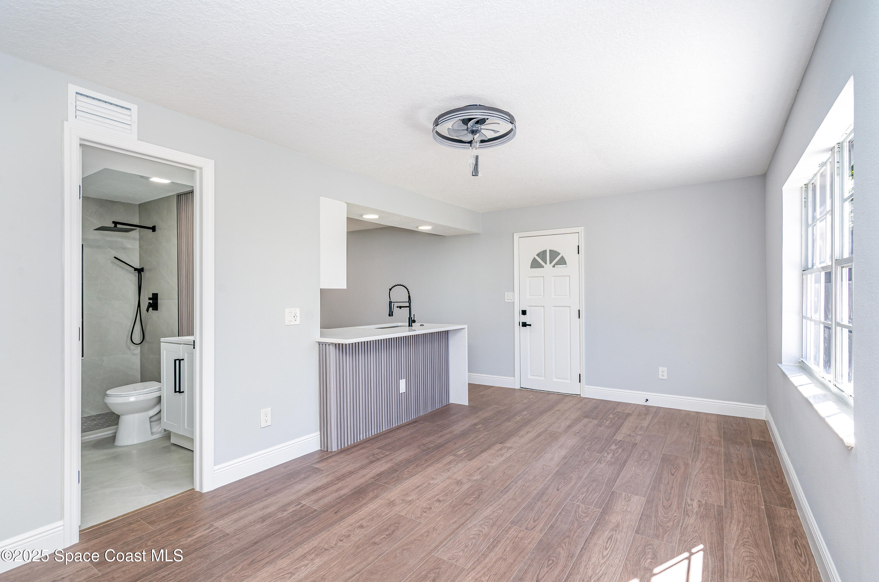 1735 Marywood Road Melbourne, FL 32934 - Photo 5 of 25 a view of a bathroom from the hallway