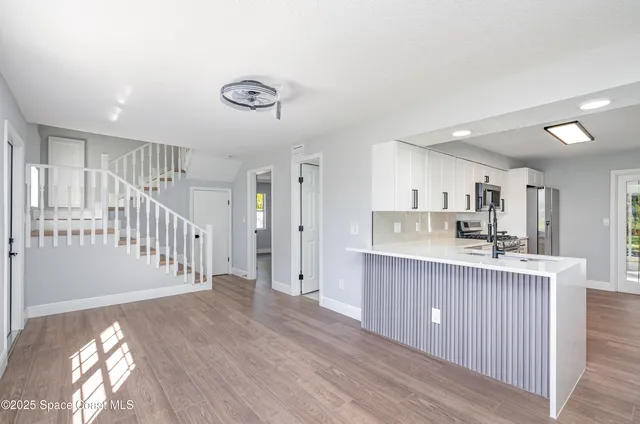 a view of a kitchen and a sink