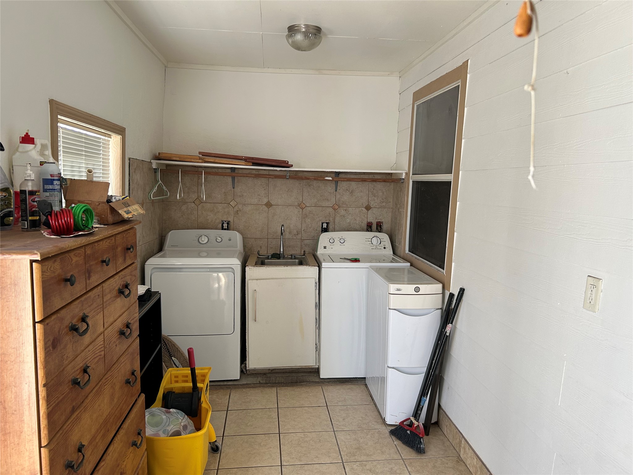 2217 Chew Street Houston, TX 77020 - Photo 12 of 17 a view of a storage & utility room with washer and dryer