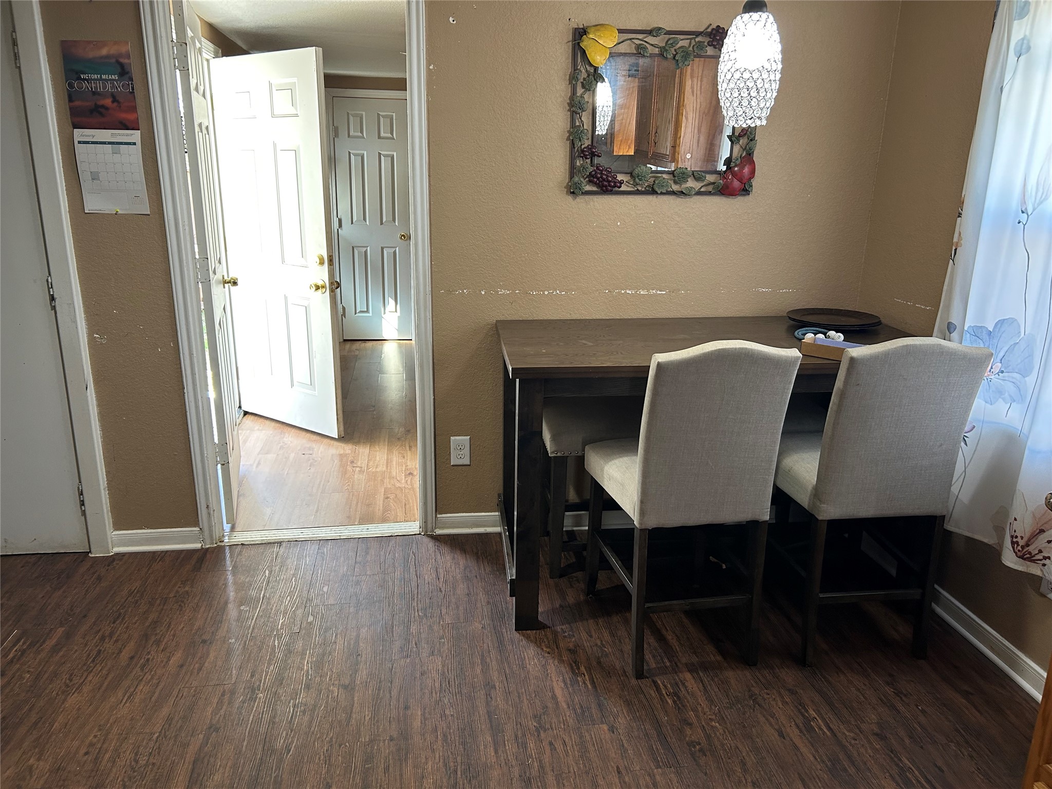 2217 Chew Street Houston, TX 77020 - Photo 7 of 17 a view of a dining room with furniture and wooden floor