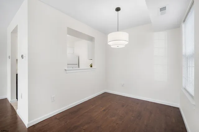 an empty room with a empty space and a window