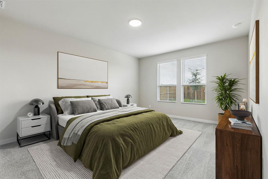 1121 Del Rio Drive Lavon, TX 75166 - Photo 12 of 32 a bedroom with a large bed and a potted plant