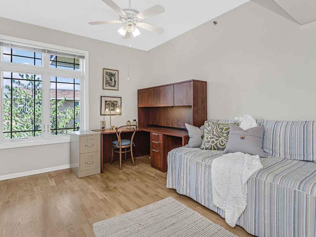 9200 East Prairie Road, Unit 403 Evanston, IL 60203 - Photo 16 of 23 a bedroom with a bed furniture and a window