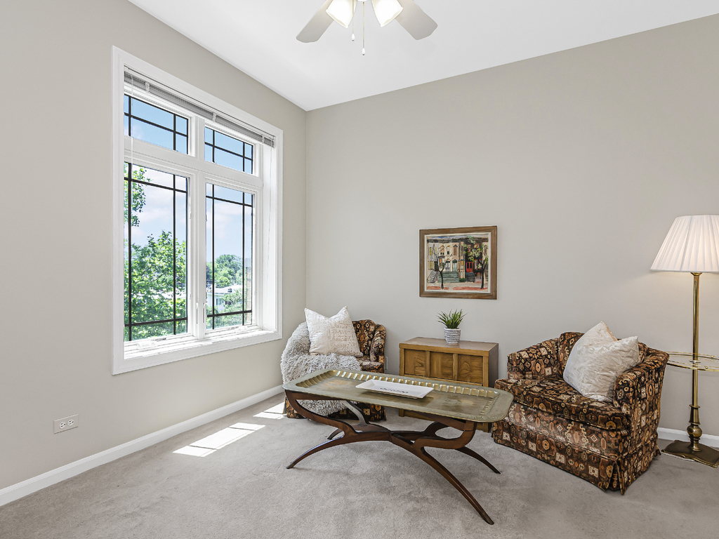 9200 East Prairie Road, Unit 403 Evanston, IL 60203 - Photo 18 of 23 a living room with furniture and a window