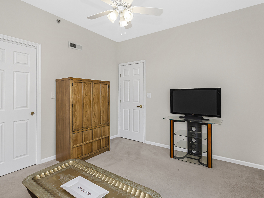 9200 East Prairie Road, Unit 403 Evanston, IL 60203 - Photo 19 of 23 a living room with furniture and a flat screen tv