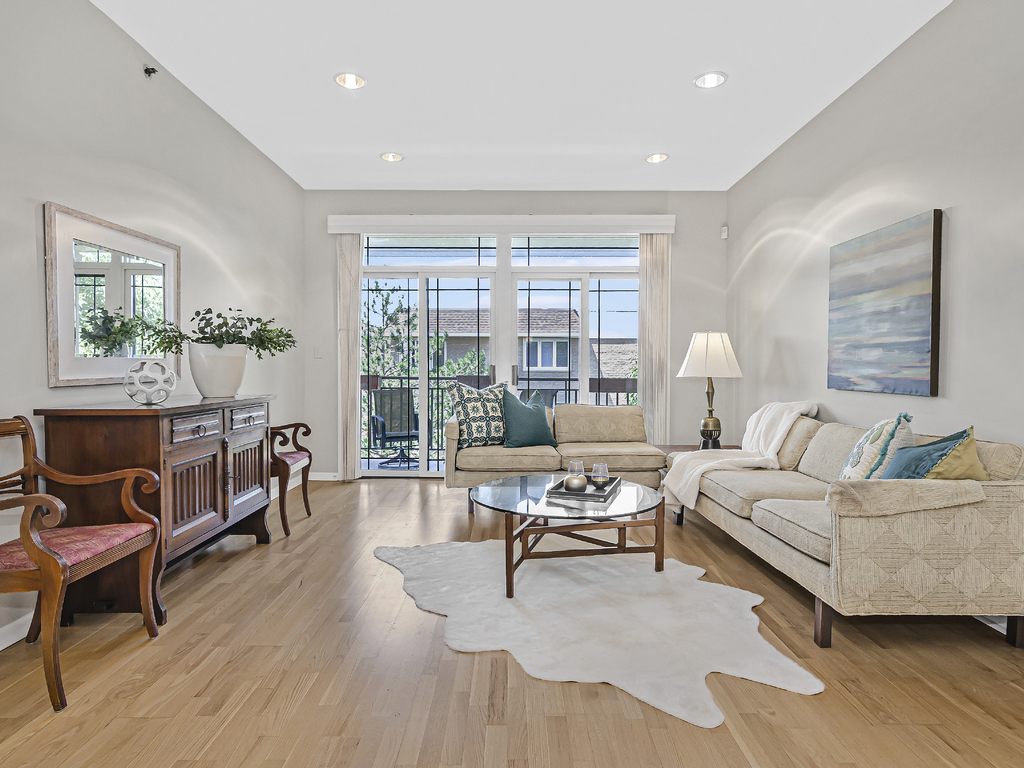 9200 East Prairie Road, Unit 403 Evanston, IL 60203 - Photo 2 of 23 a living room with furniture and a wooden floor