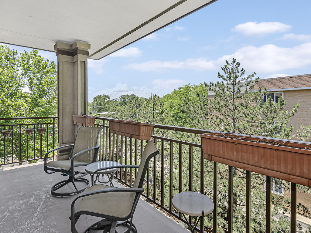 9200 East Prairie Road, Unit 403 Evanston, IL 60203 - Photo 22 of 23 a view of a chair in wooden deck