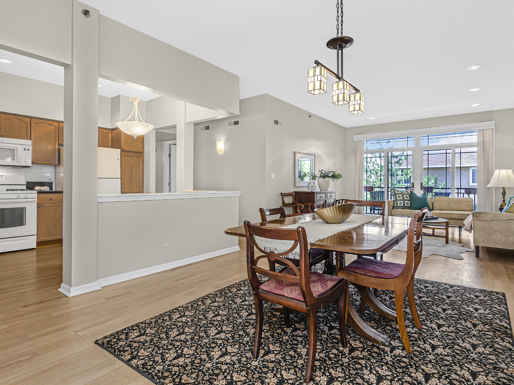 9200 East Prairie Road, Unit 403 Evanston, IL 60203 - Photo 6 of 23 a view of a dining room with furniture