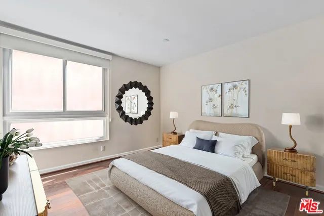 a bedroom with bed and a window