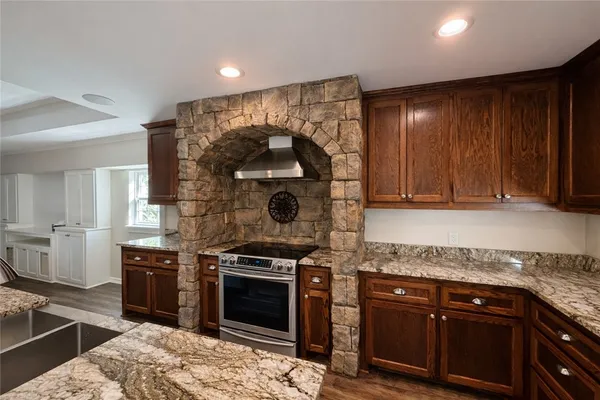 a kitchen with a stove and a sink