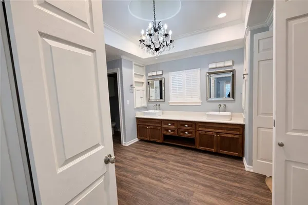 a bathroom with a sink double vanity and a mirror